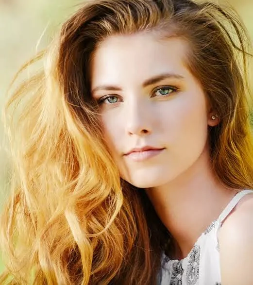 Healthy 2A hair with soft beachy waves and a lightweight polished finish