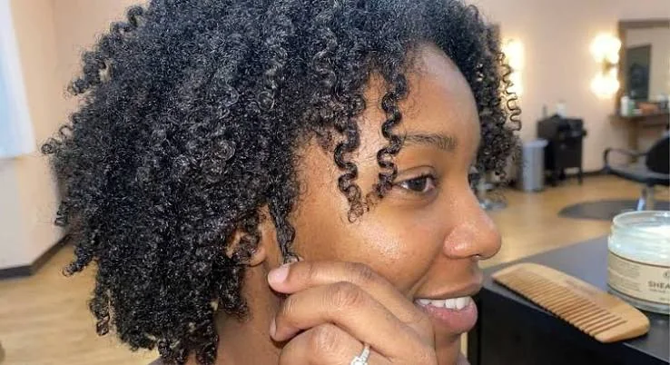 4C hair receiving a rich conditioning treatment to support soft moisturized coils