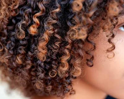 4C hair close up showing tightly packed natural coils and healthy natural texture