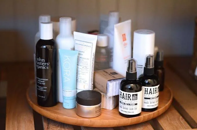 Hair mask bottles and hair care products arranged for a simple at home hair treatment routine