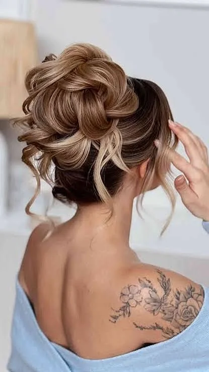 Hairstyles for long hair with a relaxed textured bun for an easy elegant updo