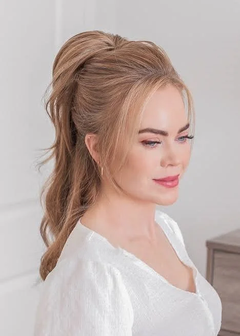 Hairstyles for long hair with a half up style that keeps the face clear while showing the length